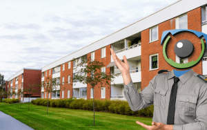 AI-powered virtual security guard standing in front of a modern apartment complex, symbolizing comprehensive apartment security systems with real-time monitoring and live deterrence.